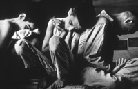 Children sitting on floor in insitutional day room