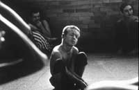 Little boy sitting on floor of day room