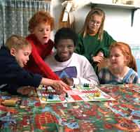 Group of children playing Parcheesi