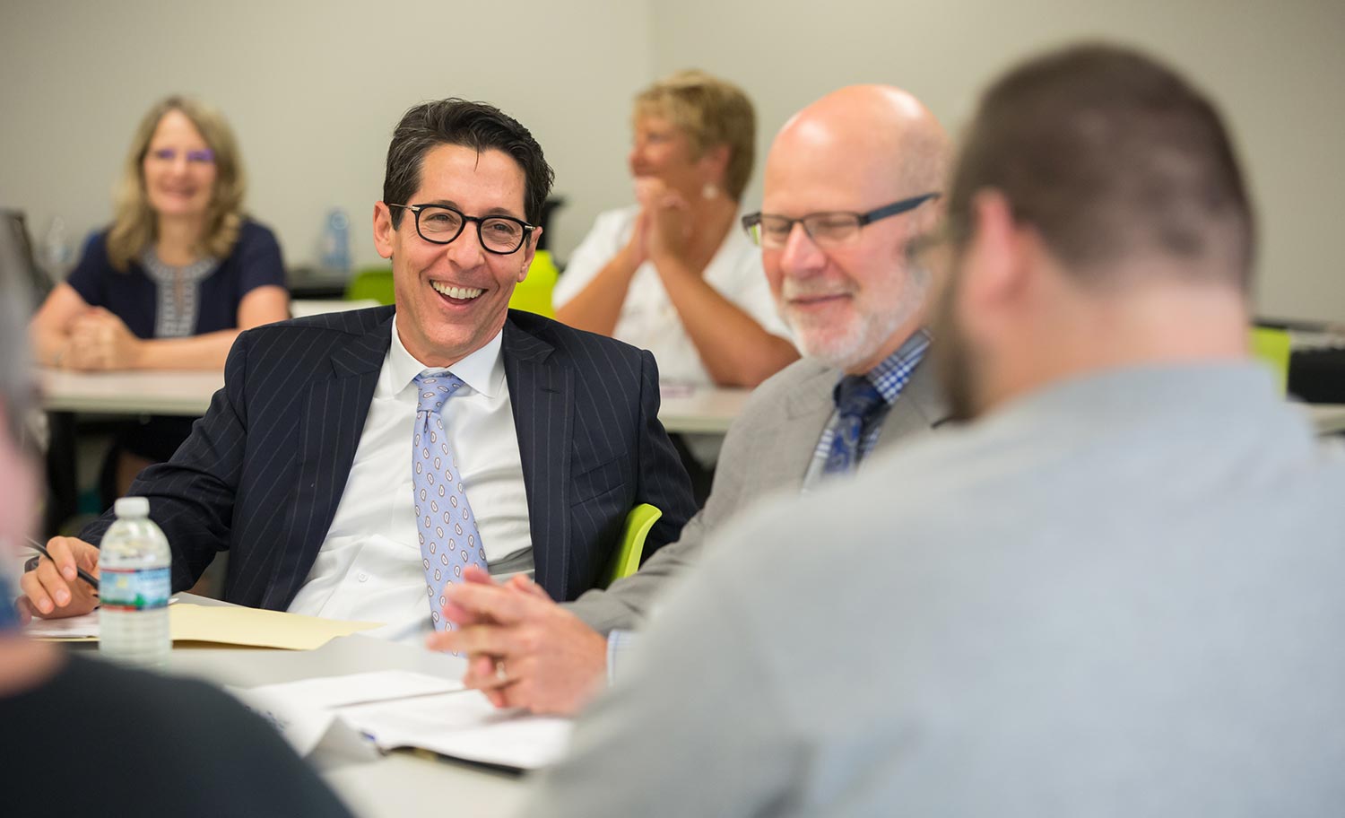Joe Torsella and Bob Baker share a laugh with other participants at the PA ABLE discussion